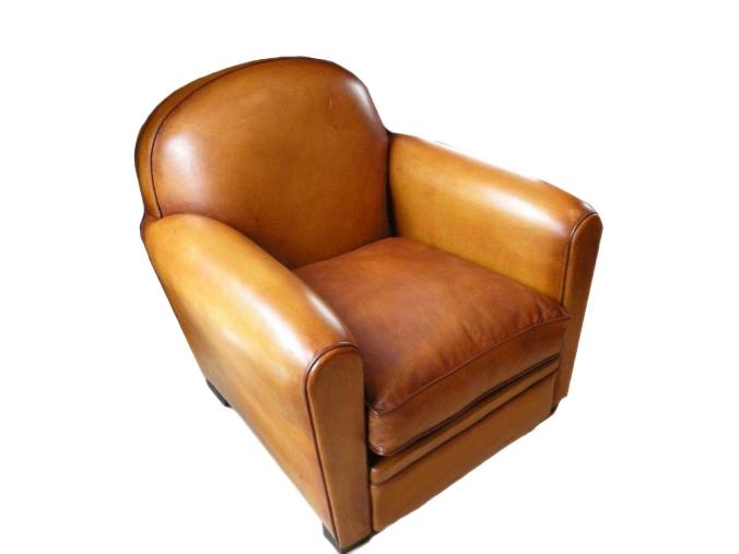 Fauteuil club  modle rond recouvert de cuir.